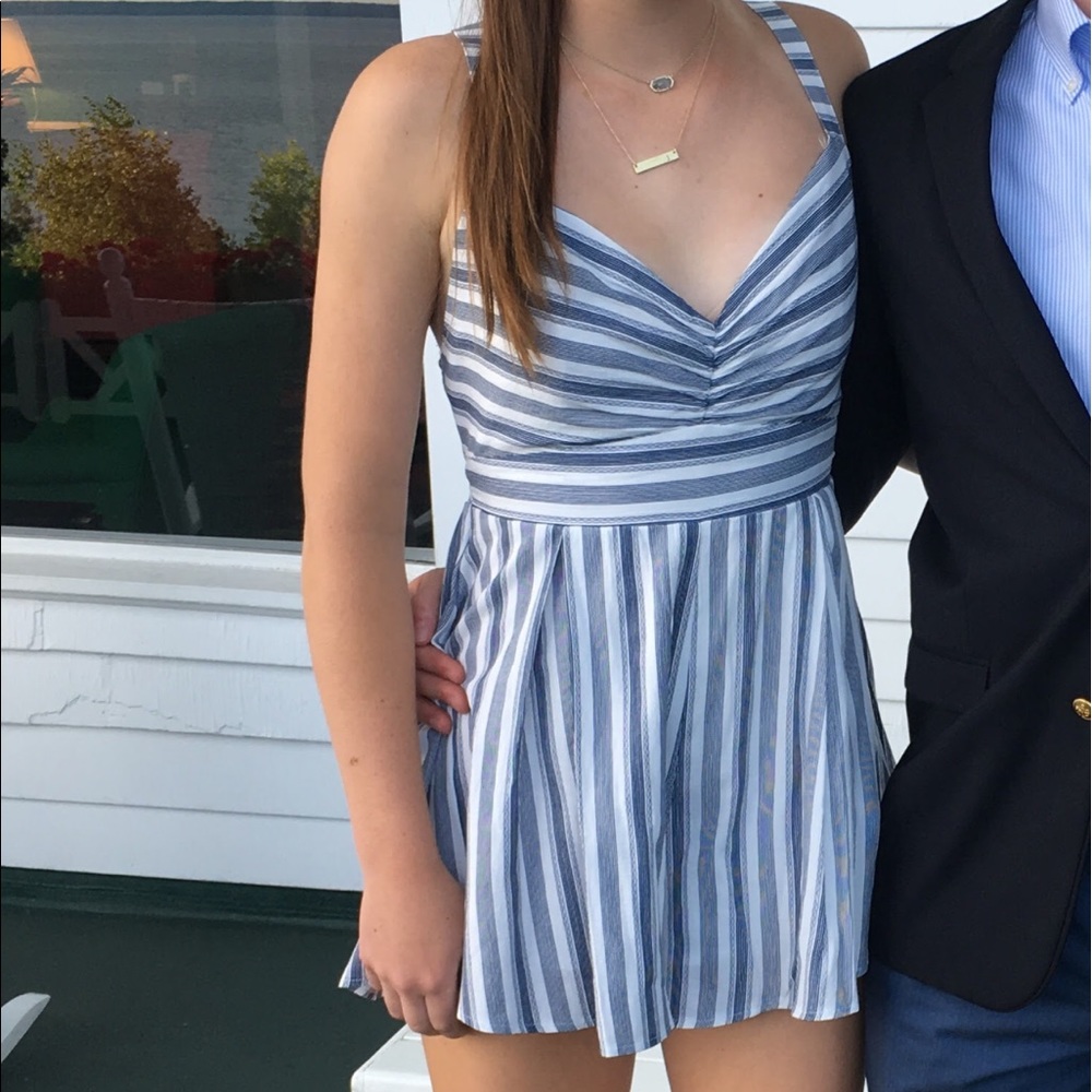 Super cute, summer romper! Ties in the back